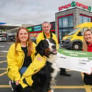 Caitlin McCartney, Ken Humphrey and Harvey the dog from SOS Bus NI are pictured with Bronagh Luke from SPAR NI, receiving their Community Cashback Grant last year. Applications for the 2024 Grant are open until 22nd May, and this year will see 20 organisations receive £1,000 each.