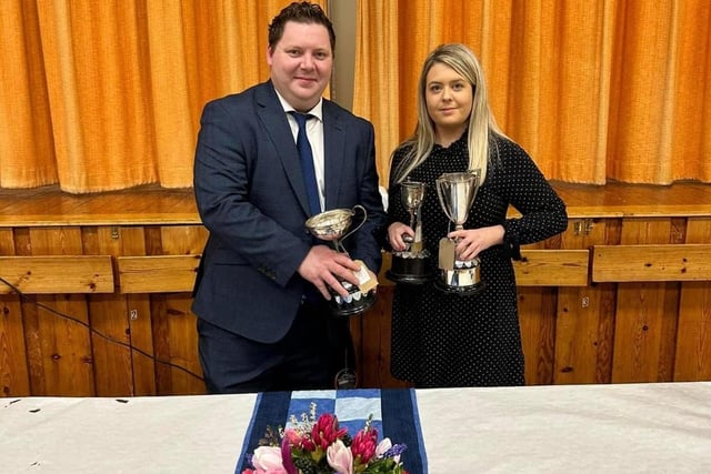 Eirinn Braniff receiving the Jean Brown cup for public speaking, the senior Floral Art cup and Ballywalter YFC cup for best senior girl
