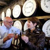 Niall Mehaffey from Bushmills Distillery has a chat with Rachel Adair from Donaghadee during the Bushmills Salmon and Whiskey Festival. Picture: Kevin McAuley/McAuley Multimedia