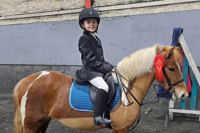 Willow Sloane with April, with her winning rosette for the 40cm class. (Pic: Ecclesville)