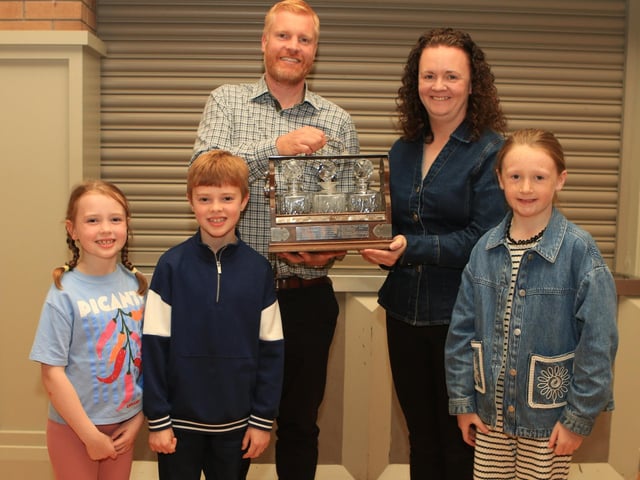 Christopher Weatherup and kids Rita and Archie pictured with Geraldine Mceduff, Countryside Services,  along with her daughter Molly presenting the Bobbie Gamble Perpetual Challenge Trophy for the best Simmental Female born on or after 1st January 2023 – 30th June 2024 at Balmoral show for LISGLASS SAPPHIRE