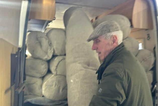A delivery of wool logs being offloaded in County Antrim.