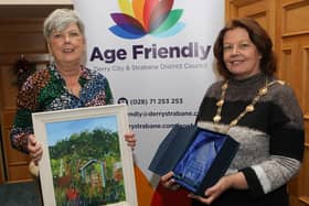 Mayor Patricia Logue makes a presentation to Linda Ming, third place in the Age Friendly "Your Happy Place" competition. Photo - Tom Heaney, nwpresspics)