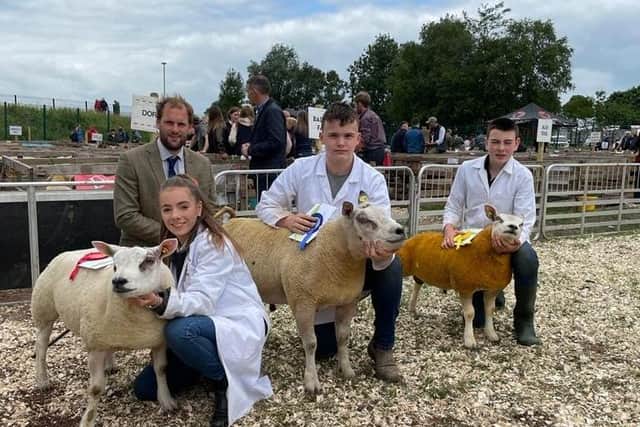 Secondary School Young Handlers Victoria Ferguson (1st), Jack Keys (2nd) and Johnny Porter (3rd) pictured with judge Grant Maxwell.