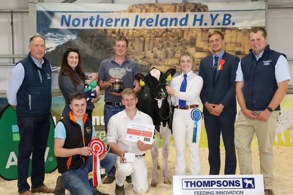 Champion Holstein calf was Damm Renegade Sallie exhibited by the Simpson family, pictured with Ashley Fleming, NI Sales Manager AHV, Mark Henry, Isaac Moore, Lauren Henry, handler, Jason Helen, judge & Phil Donaldson, Thompsons. (Pic supplied by NIHYB)