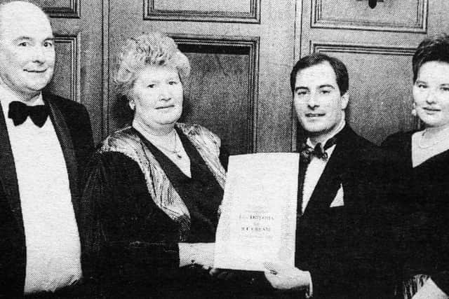 1992 - Mr. S. Boni, President of the Ice Cream Alliance, presents a Diploma of Merit to Mrs. Mary McGroggan. Looking on are (from left) Mr. Brian McGrogan, Patricia McGroggan and Paul McGroggan. INBT13-751F