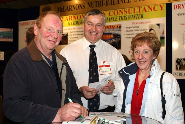 Harold Stevenson, McLarnon Feeds, with Stephen and Yvonne McAllister, Dungannon, on the McLarnon Feeds stand at the RUAS Winter Fair.