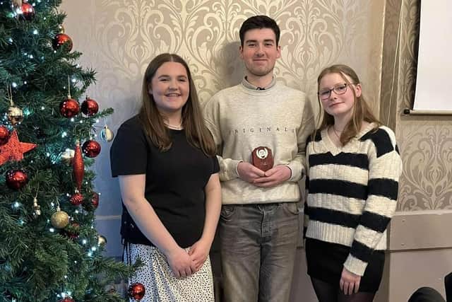 Joanna Caughey, Cole Hogg and Summer Henderson at Donaghadee YFC's Christmas dinner and awards night. Picture:  Donaghadee YFC