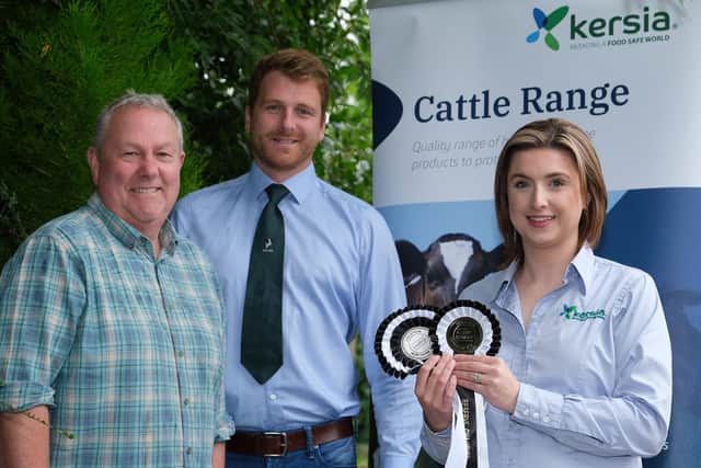 Emma Kerrigan, Kersia, discusses sponsorship of the Dungannon Dairy Sale with Holstein NI chairman Jonny Lyons, and committee member Mark Logan. 
Photograph: Columba O'Hare/ Newry.ie