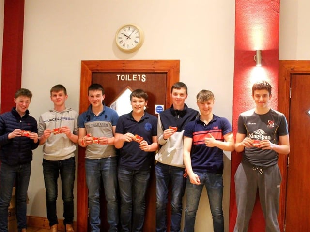 Members and their friends collecting their prize for coming last plac
