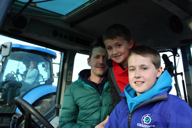 Junior Magill with his two sons at the tractor run.