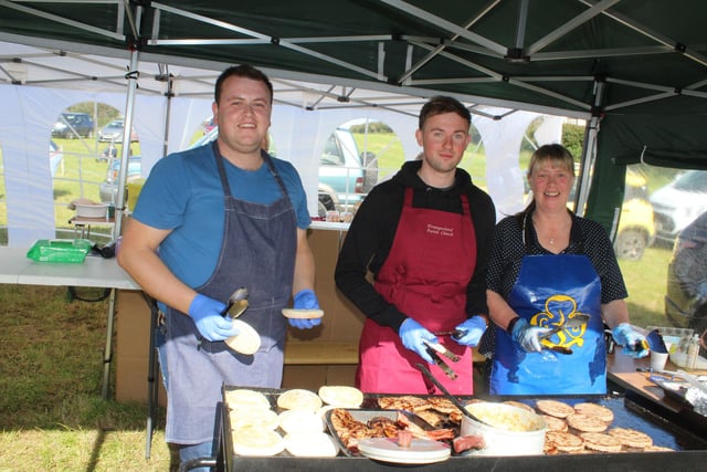 These members of Ballyward Parish Church were kept busy serving burgers last Saturday (from left) Matthew Murphy, David Harte and Louise Harte