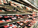 Meat and poultry products on shelves in a supermarket