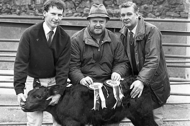 The champion calf at a show and sale of Blonde d’Aquitaine calves at Ards Mart in January 1992 was exhibited by Adrian McClure, left, of Ballywalter. Included are Alan Montgomery, centre, public relations officer for the club, and Harry Brown of Lisburn, who judged the animals. Picture: Farming Life/News Letter archives