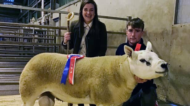 Pictured is Robert Walmsley White Water Farm with his shearling ram exhibit with Judge Naomi O'Hare handing over the Fane Valley Champion rosette at the NI Texel Sheep Breeder's Show and Sale in Hilltown.