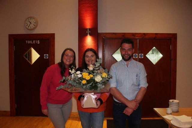Club secretary, Joanna Caughey presenting a gift of thanks to outgoing club leader Alan Russell and Hayley-Rae Hopkins