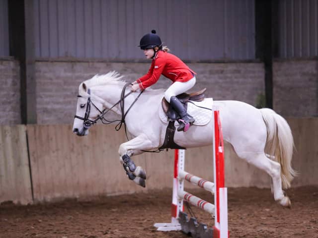 Lacie McDowell and Dixie on their way to a Rising stars qualification in the 80cm class. (Pic: Ellie Johnston Photography)