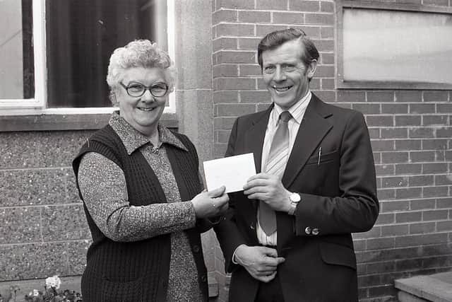 Pictured in March 1983 is Derek Reid, secretary of the Greenmount Association, presenting Miss Lily Ward, who was retiring, with a cheque as thank you for her service to the association. Picture: Farming Life/News Letter archives