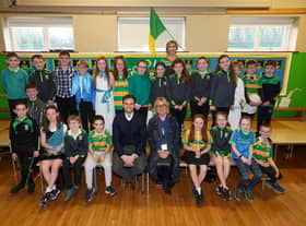 Children from St Patrick’s and St Joseph‘s Primary School, with class teacher Mrs Catherine Ball (back row), Pauline Davison, ABO Wind's educational and community outreach teacher and Michael Mullan, development project manager at ABO Wind (front row)