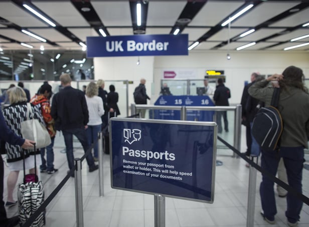 <p>Border Force check the passports of passengers arriving. Photo: Getty Images</p>