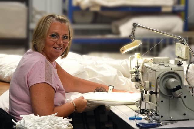 Devon Duvets seamstress handcrafting British wool duvets. Picture: Henrietta Lilley