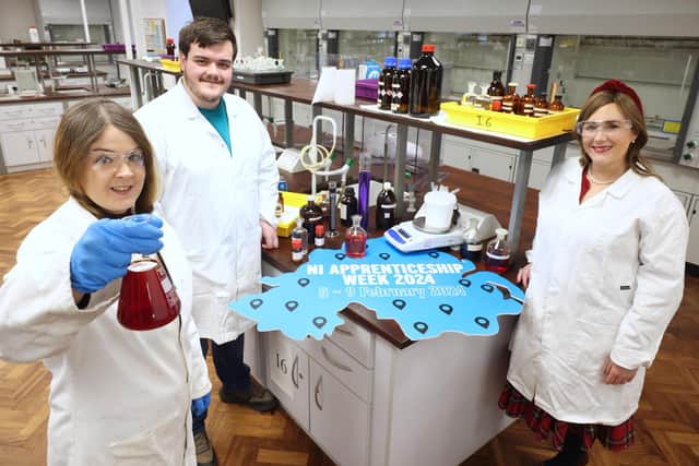 Pictured in the School of Chemistry and Chemical Engineering at Queen’s University Belfast are (left to right) level 3 lab technician apprentices Rachel Campbell and Davog Davenney with Moira Doherty, head of skills and education at DfE. Picture: Submitted
