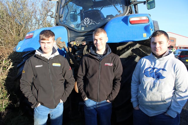 Waiting for the tractor run to start, from left, Adam Copeland, Matthew Boyd and John McCelland.