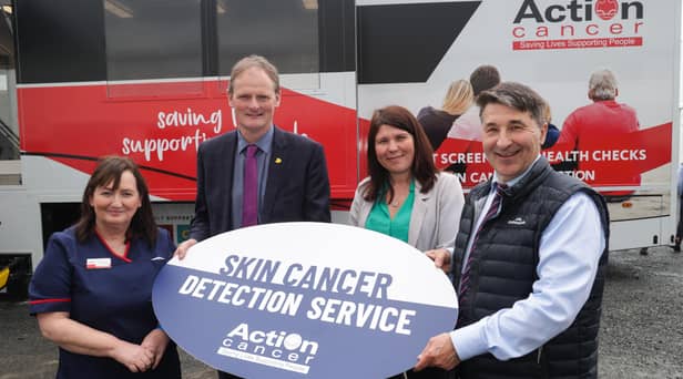 Iona McCormack, David Brown, Carol Marshall and Gareth Kirk (CEO, Action Cancer) pictured in front of the Big Bus