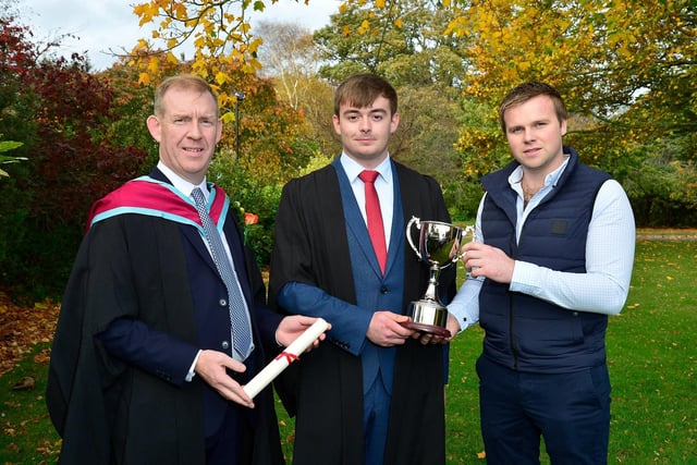 Martin Mayberry (Kilrea) was presented with the Hall Cup for work experience performance by Charles Keys (M Keys Farms) at the Greenmount Campus graduation event. Also featured is Joe Mulholland (Course Manager, CAFRE).