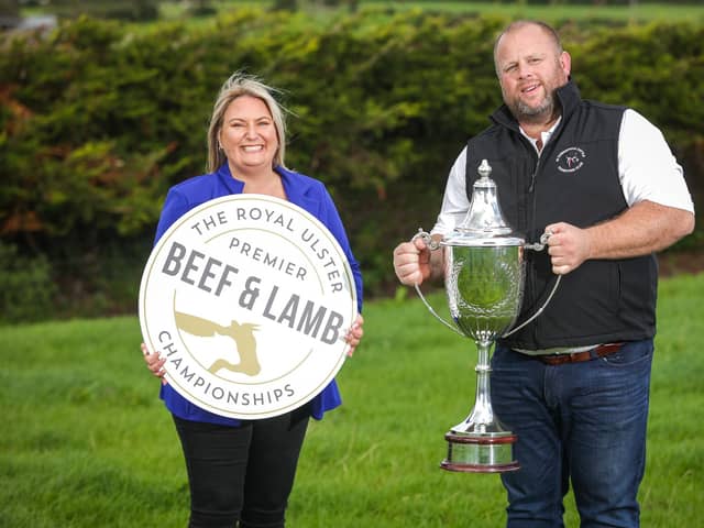 Carolyn Greene from RUAS joins Gareth Corrie from JCB Commercials, who were awarded last year’s Supreme Champion, to remind livestock exhibitors that entries for the 2023 Beef & Lamb Championships will close on Tuesday 31st October at 5pm. Pic: Brian Thompson