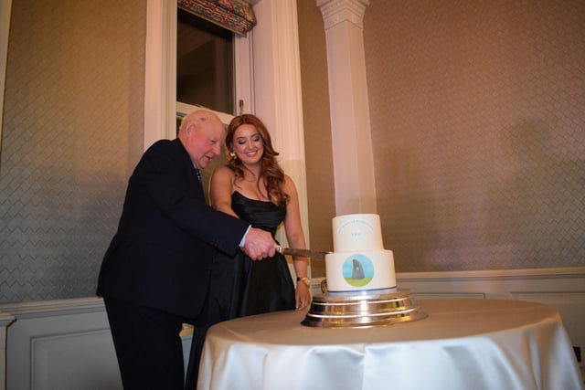 Ian Patterson and Clara McConnell cutting the cake at the Holestone YFC 80th anniversary dinner at the Galgorm Resort. Picture: Holestone YFC