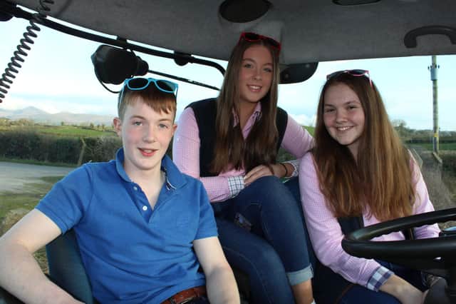 Daniel Shannon, Bethany Ewart and Rachel Beggs looking forward to the tractor run at Rathfriland.