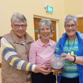 From left to right, Joan Hamilton, Myra Hutchinson, Jennifer Johnston, winners of the Morton trophy along with President Elizabeth McConnell