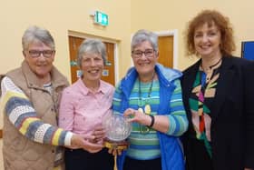 From left to right, Joan Hamilton, Myra Hutchinson, Jennifer Johnston, winners of the Morton trophy along with President Elizabeth McConnell