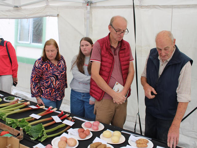 Ernie Mathers with Brian Moorhead showing his prize winning vegetables