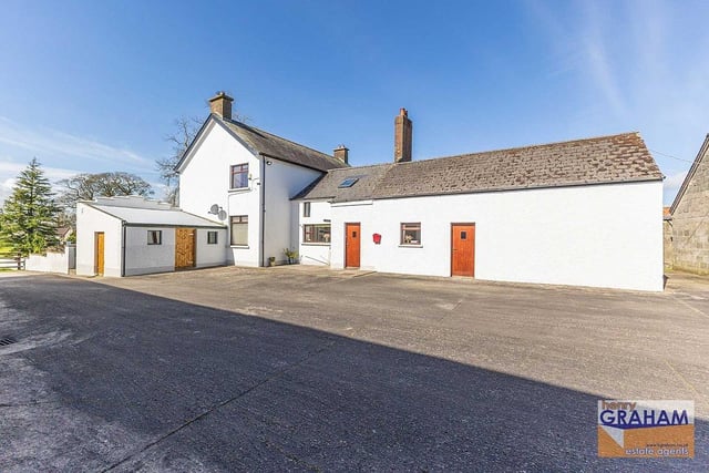 The detached two-storey farmhouse is set in approximately two acres and comprises two spacious reception rooms, a country kitchen/dining area with oil fired AGA range, four bedrooms and a recently refitted luxury shower room. Image: www.hgraham.co.uk