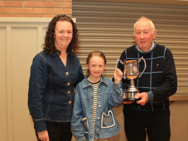 Geraldine McElduff, Countryside Services, with her daughter Molly presenting Robert Forde with the William Black Memorial Perpetual Cup for Male Champion at Balmoral show with MULLYKNOCK SCORPIO