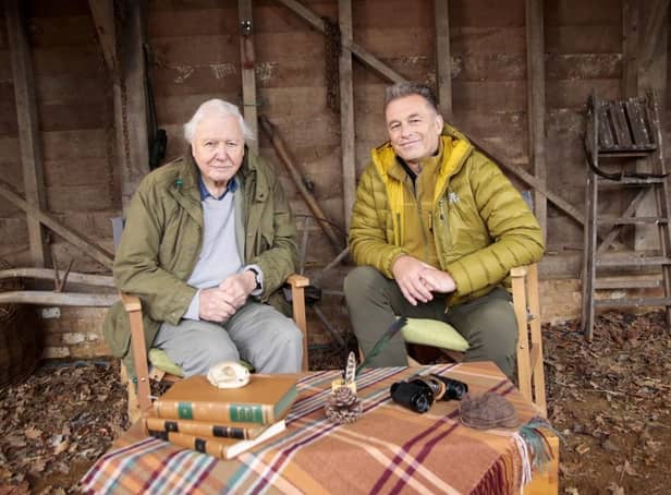 <p>Sir David Attenborough (left) speaking to the presenter Chris Packham for Winterwatch. (Photo credit: BBC/PA Wire)</p>
