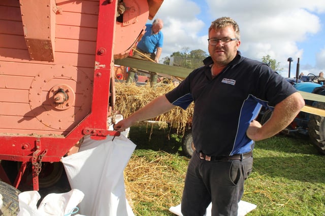 Jonny McCallister looking after the bags of corn at the threshing day.
