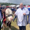 William Irwin MLA with a show exhibitor and his colleague Edwin Poots MLA.