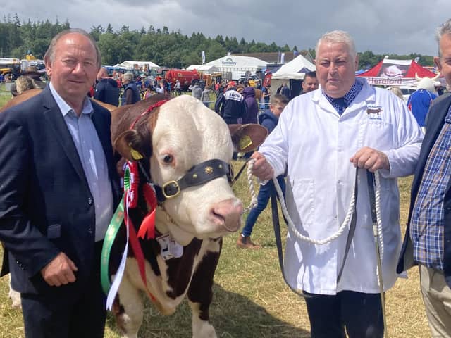 William Irwin MLA with a show exhibitor and his colleague Edwin Poots MLA.