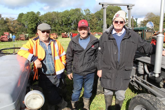 Attending the threshing day, from left, Cathal Livingston, Jonny McSorley and Ernest Park.