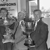 Pictured in May 1992 at the Ballymoney Show is Victor Truesdale, second left, of John Thompson, presenting the company’s livestock championship awards to, Alfie Martin, Crumlin (best Large White pig of opposite sex to the champion), Robert Kerr, Ballymoney (best Large White pig in show) and Robert Wallace, Antrim (best Holstein Friesian in show. Picture: News Letter archives/Darryl Armitage