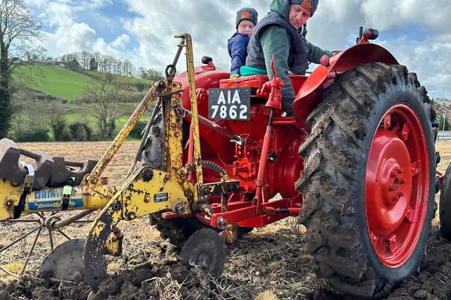 Graham Hutchinson and son Alfie keep an eye on the ploughing