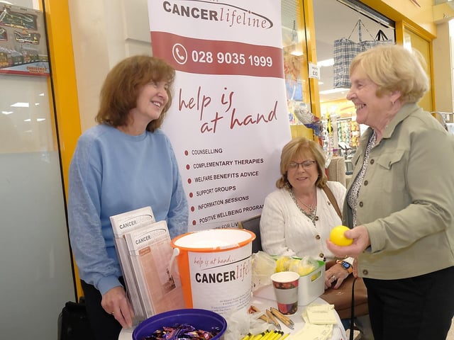 Moira McCallan (Cancer Lifeline) talking to shoppers at the community event.