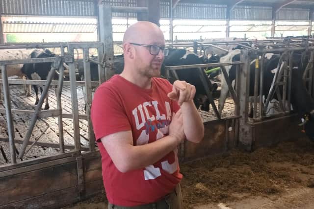 Conor Casey from Cloughmills, Co Antrim, a Dairy Technology Demonstration Farmers, pictured on his home farm during a recent visit organised by Cogent UK.