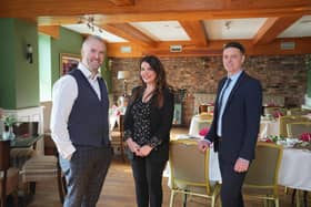 Caorlan and Ciara McAllister pictured with Ulster Bank business development manager Lee White. Pic: Aaron McCracken