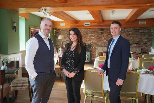 Caorlan and Ciara McAllister pictured with Ulster Bank business development manager Lee White. Pic: Aaron McCracken