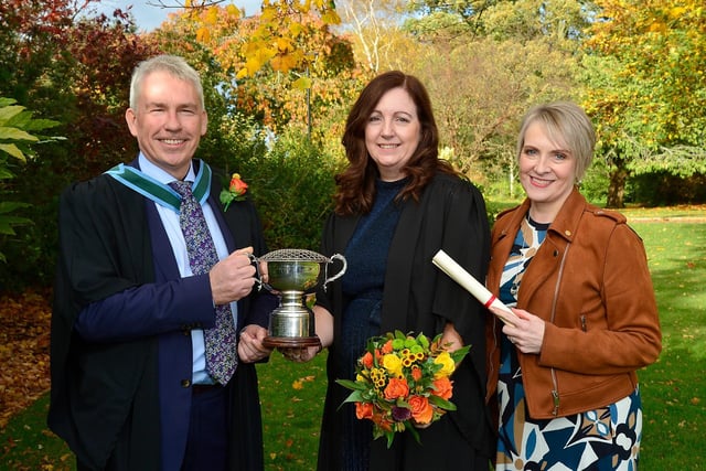 Edel Michael (Maghera) was awarded the Victoria Rose Bowl for progress in practical Floristry when she graduated with a Level 2 Technical Certificate in Floristry at the Greenmount Campus autumn graduation event. Congratulating Edel are Paul Mooney (Head of Horticulture, CAFRE) and Sherry Suett (Lecturer, CAFRE).