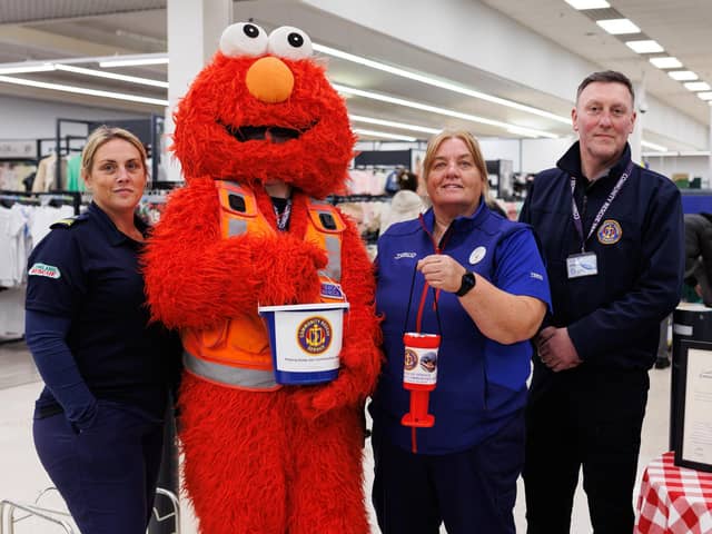 Kerry Whitehouse, CRS Antrim District Unit Commander and Fundraiser Officer, special guest Elmo, Donna McCotter, Community Champion at the Tesco Yorkgate store in Belfast, and Dominic McIlroy, CSR Belfast District Unit Commander.